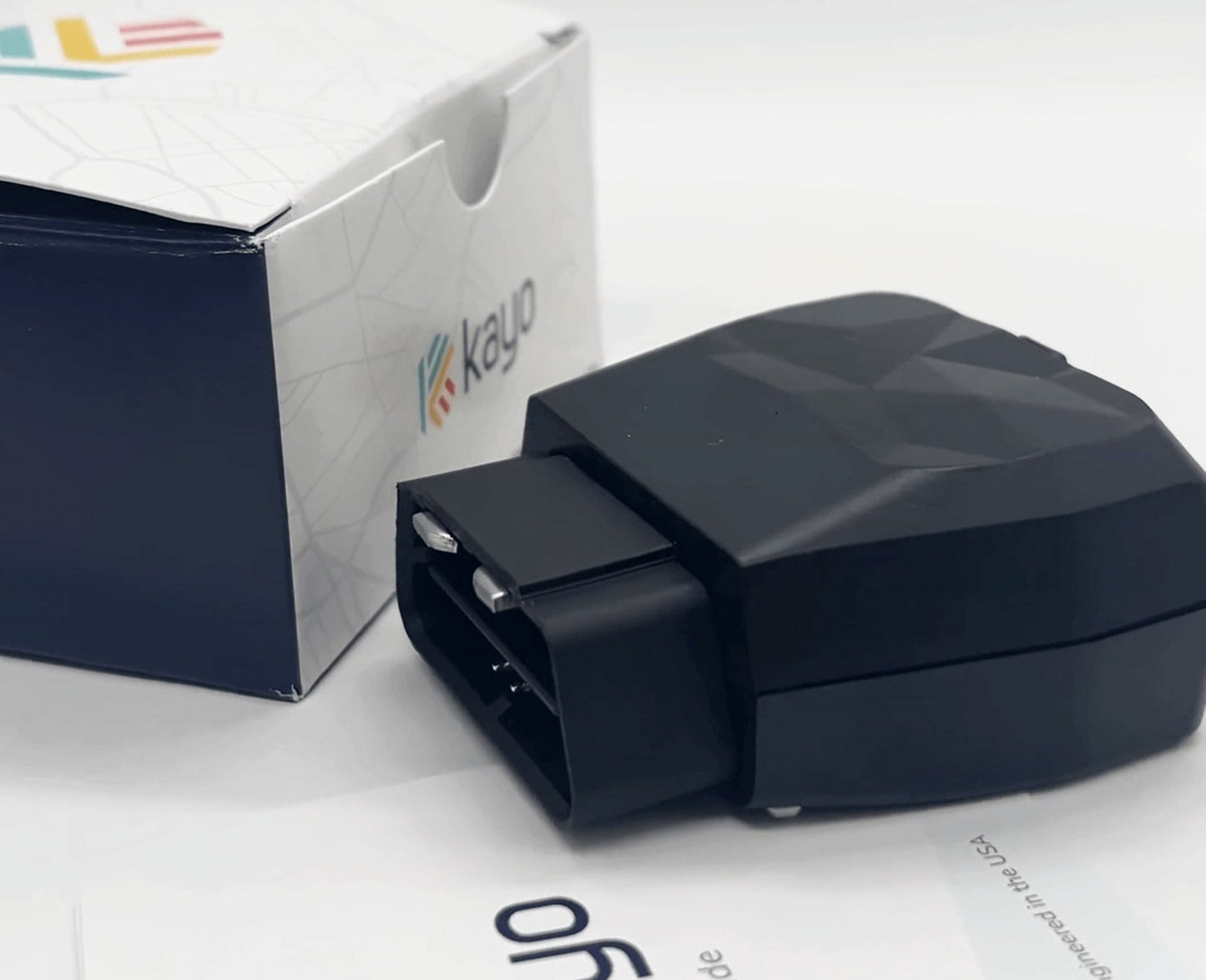 Side view of unboxed Kayo GPS tracker  & OBD scanner